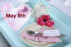 Happy Mothers Day aqua blue breakfast morning tea vintage retro shaby chic tray setting with antique fine china plates, pink carnations and sugar bowl.