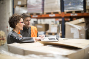 Warehouse workers checking inventory, when to move to 3PL