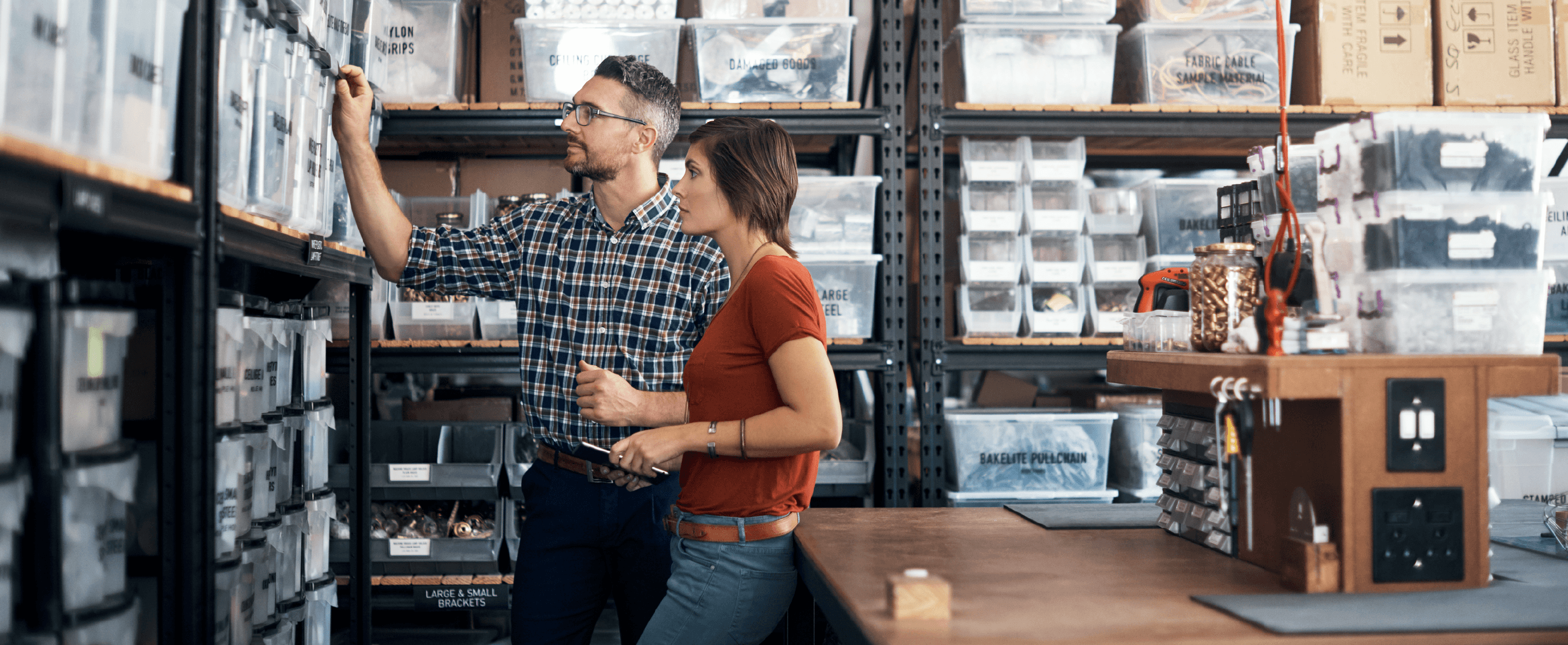 man and woman in warehouse