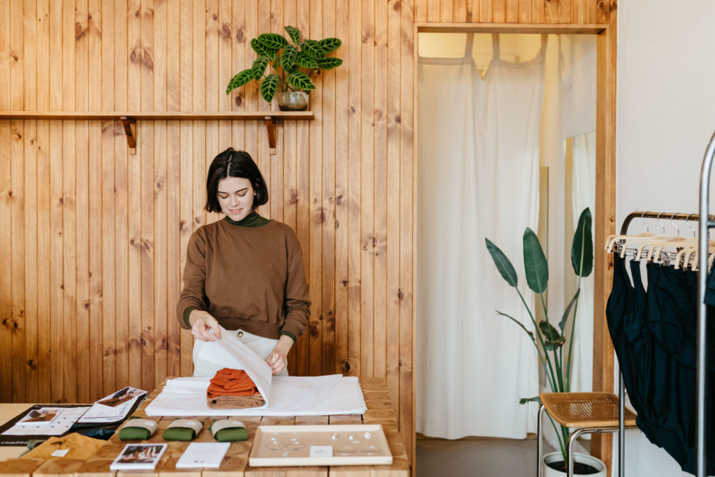 Woman using eco-friendly packaging materials.