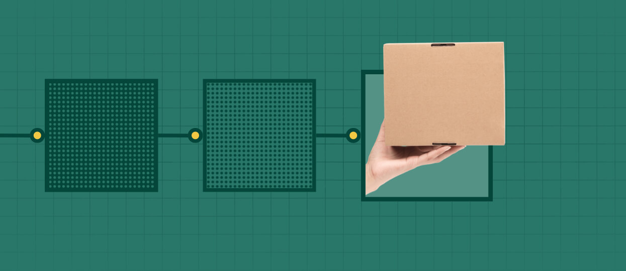 hand holding up a cardboard shipping box with a green background
